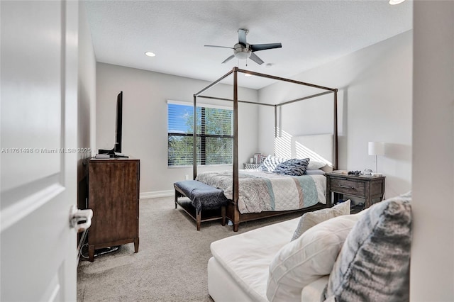 carpeted bedroom with recessed lighting, a textured ceiling, baseboards, and a ceiling fan