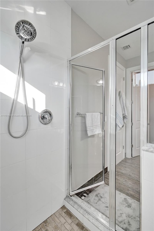 full bath featuring visible vents and a shower stall