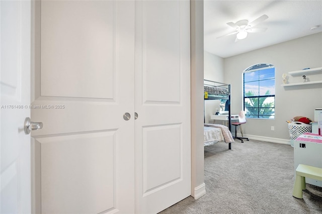 bedroom featuring carpet flooring and baseboards