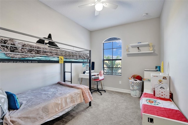 bedroom with carpet flooring, a ceiling fan, and baseboards