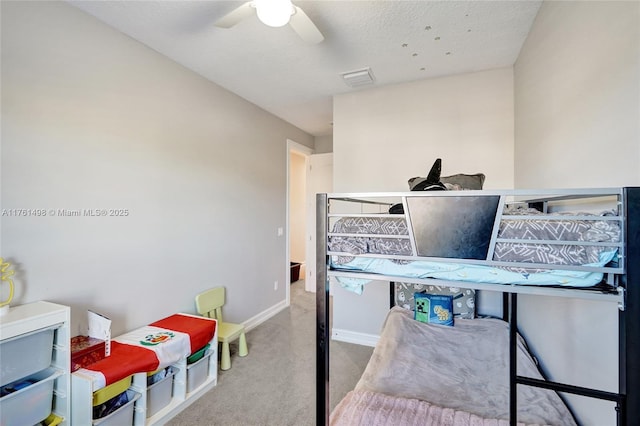 bedroom featuring visible vents, a ceiling fan, baseboards, and carpet floors