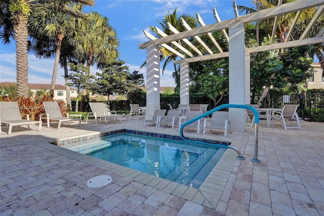 view of swimming pool with a patio, fence, and a pergola