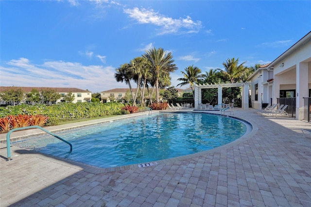 community pool featuring a pergola and a patio