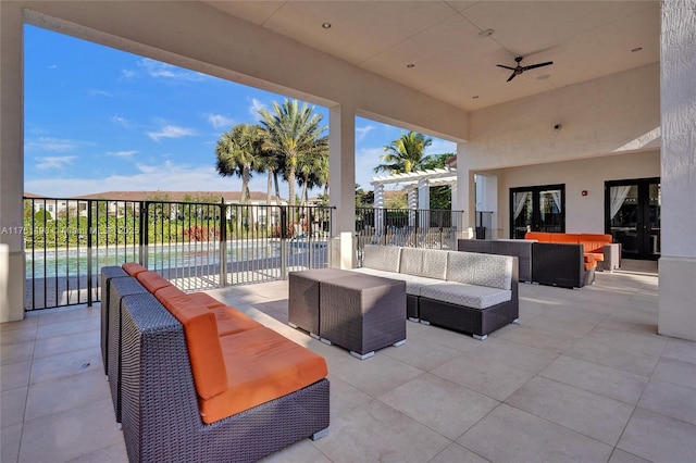 view of patio featuring an outdoor living space, a pergola, a ceiling fan, and fence