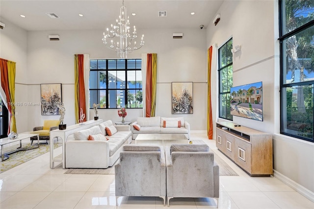 living room featuring light tile patterned floors, visible vents, and plenty of natural light