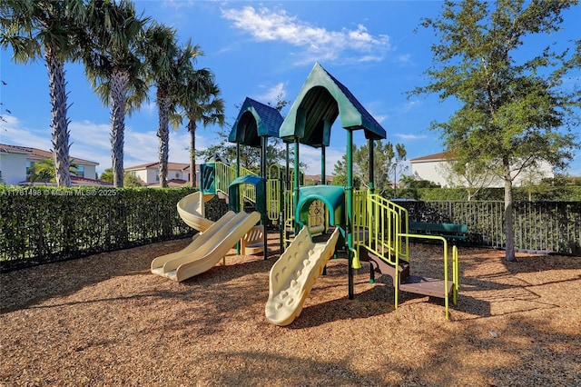 community jungle gym featuring fence