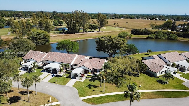 birds eye view of property with a water view