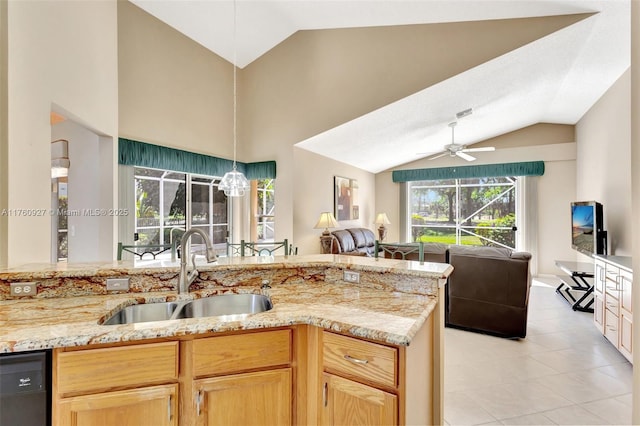 kitchen with a ceiling fan, a sink, vaulted ceiling, black dishwasher, and open floor plan