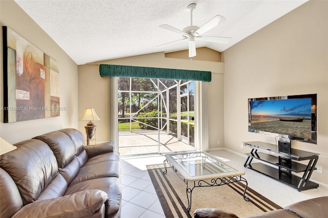 living area featuring tile patterned flooring, vaulted ceiling, a sunroom, and a textured ceiling