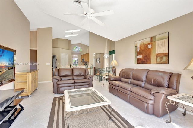 living room with light tile patterned floors, visible vents, high vaulted ceiling, and ceiling fan