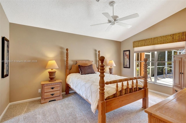 bedroom with light colored carpet, baseboards, and lofted ceiling