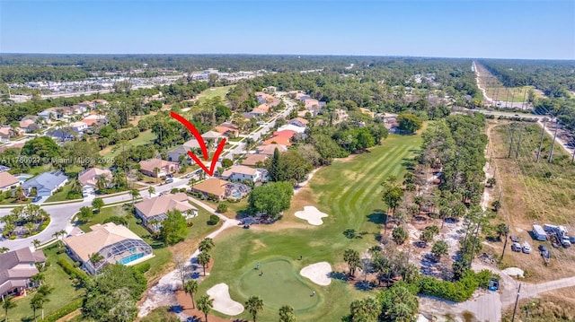 aerial view with a residential view and view of golf course