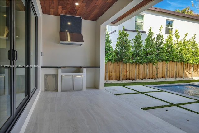 view of patio featuring fence