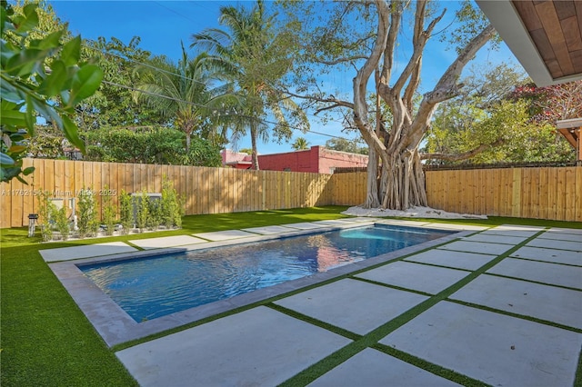 view of pool featuring a fenced backyard, a fenced in pool, and a lawn