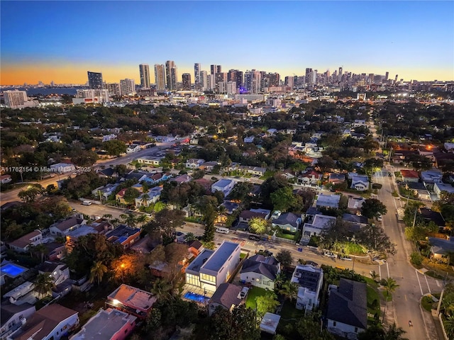 aerial view at dusk with a city view