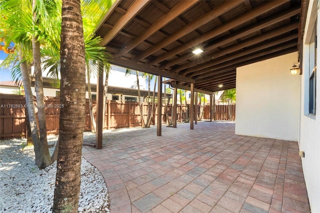 view of patio featuring fence