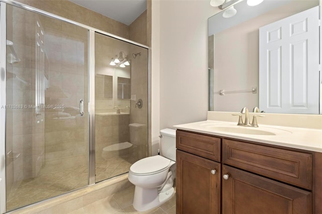 full bath with tile patterned floors, a stall shower, toilet, and vanity