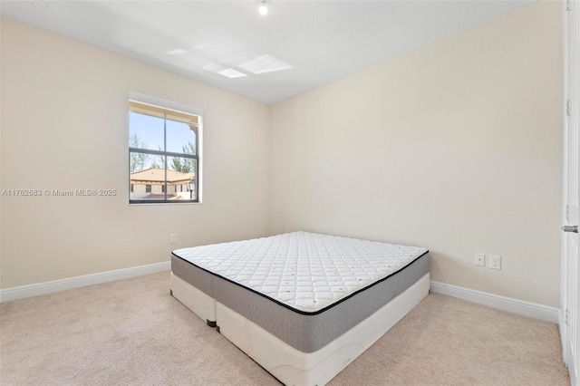 carpeted bedroom with baseboards