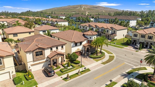 drone / aerial view with a residential view and a mountain view