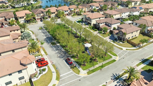 aerial view with a residential view and a water view