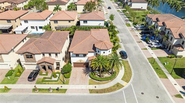 aerial view featuring a residential view and a water view