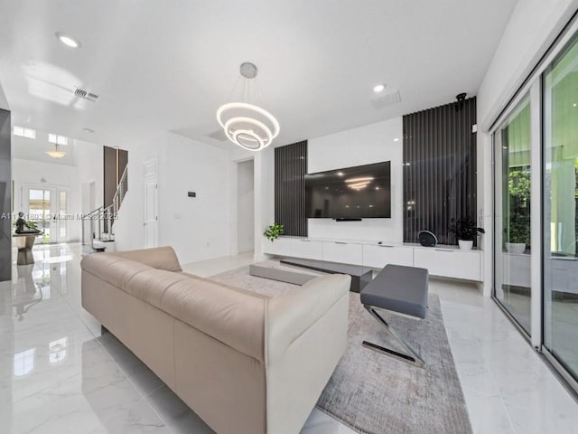 living area featuring recessed lighting, a notable chandelier, visible vents, and marble finish floor