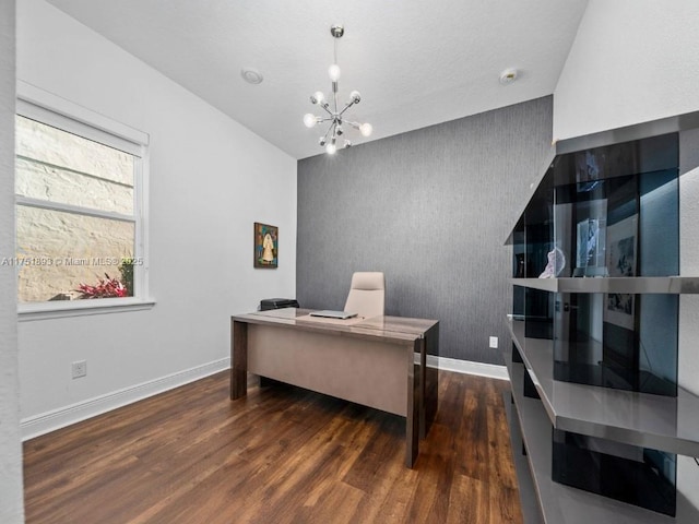 office area featuring a notable chandelier, wood finished floors, and baseboards