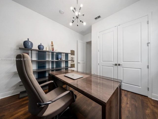 office space featuring a notable chandelier, visible vents, baseboards, and wood finished floors