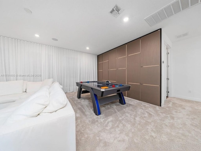 recreation room with light carpet, visible vents, and recessed lighting