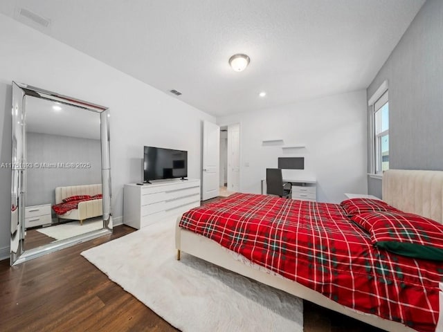 bedroom featuring recessed lighting, visible vents, and wood finished floors