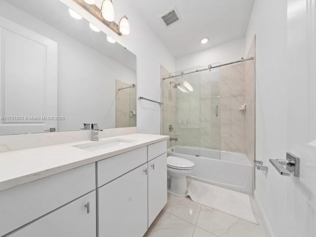 bathroom featuring visible vents, toilet, combined bath / shower with glass door, marble finish floor, and vanity