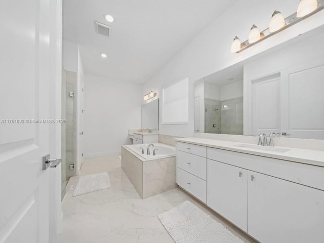 bathroom featuring vanity, a shower stall, visible vents, and marble finish floor