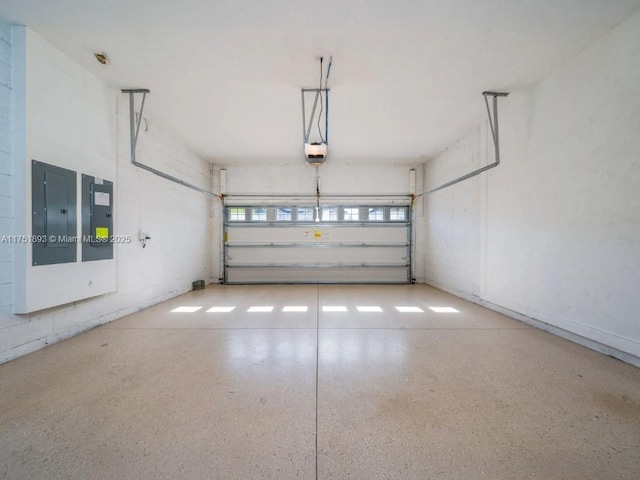 garage featuring electric panel and a garage door opener