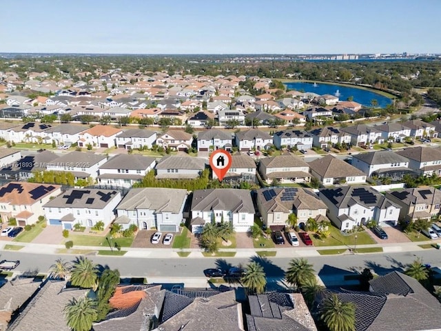 aerial view featuring a residential view and a water view