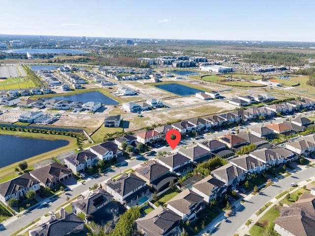 bird's eye view with a water view and a residential view