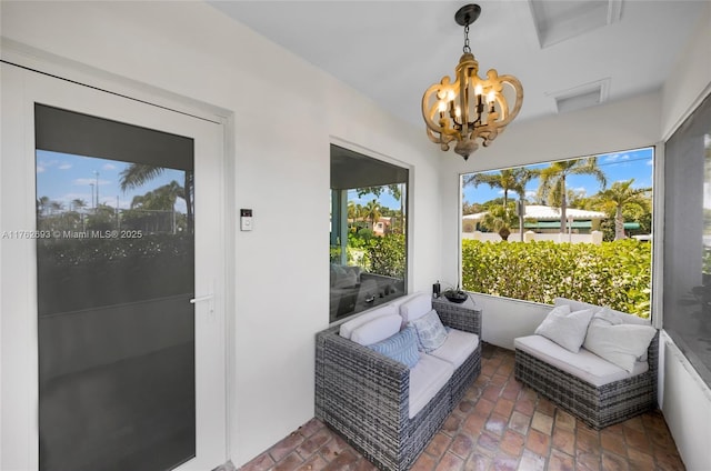 sunroom with a notable chandelier