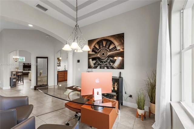 office featuring visible vents, baseboards, light tile patterned floors, arched walkways, and a notable chandelier