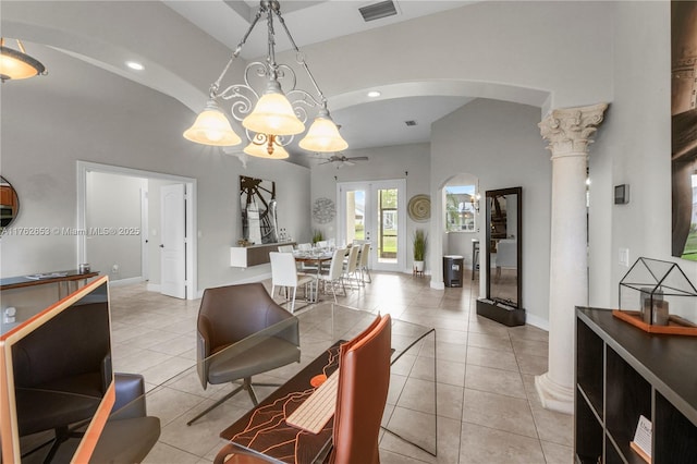 interior space featuring arched walkways, visible vents, baseboards, and light tile patterned floors