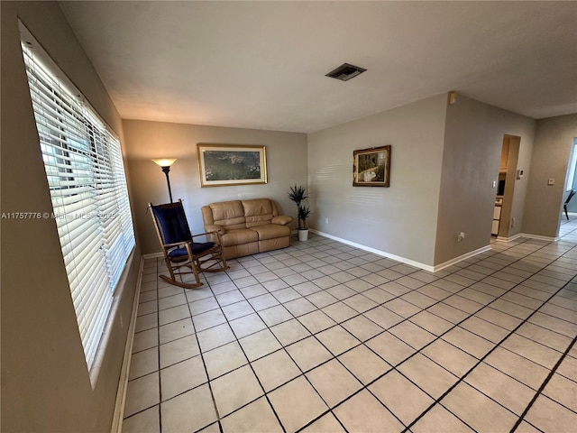 unfurnished room featuring visible vents and baseboards