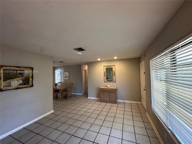 unfurnished room featuring light tile patterned floors, visible vents, baseboards, and recessed lighting