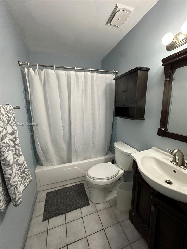 full bath featuring tile patterned floors, toilet, shower / bath combo, and vanity