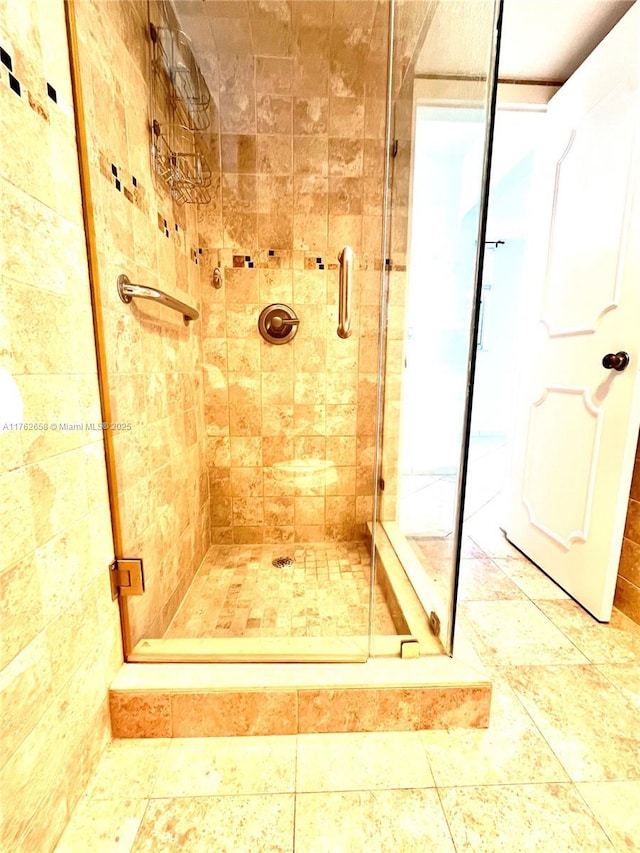 bathroom with a shower stall