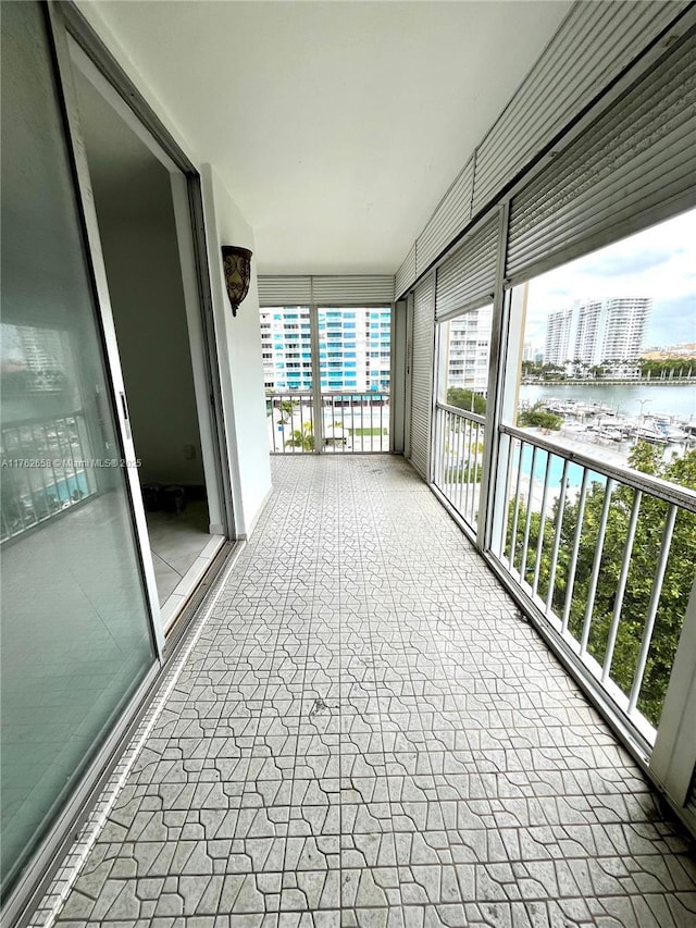 balcony featuring a water view