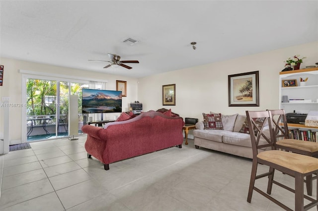 12140 Bruceton Way Unit 102, Orlando, FL 32828 - living area featuring visible vents, ceiling fan, and light tile patterned floors