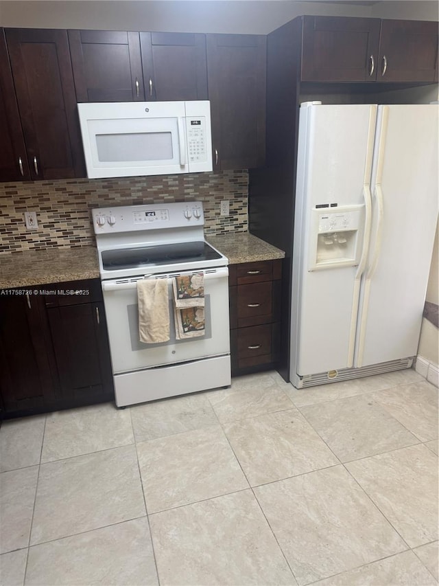 kitchen with decorative backsplash, white appliances, dark brown cabinets, and light tile patterned flooring