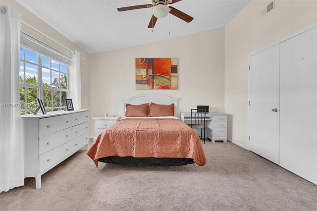 12140 Bruceton Way Unit 102, Orlando, FL 32828 - bedroom with lofted ceiling, a ceiling fan, visible vents, and carpet