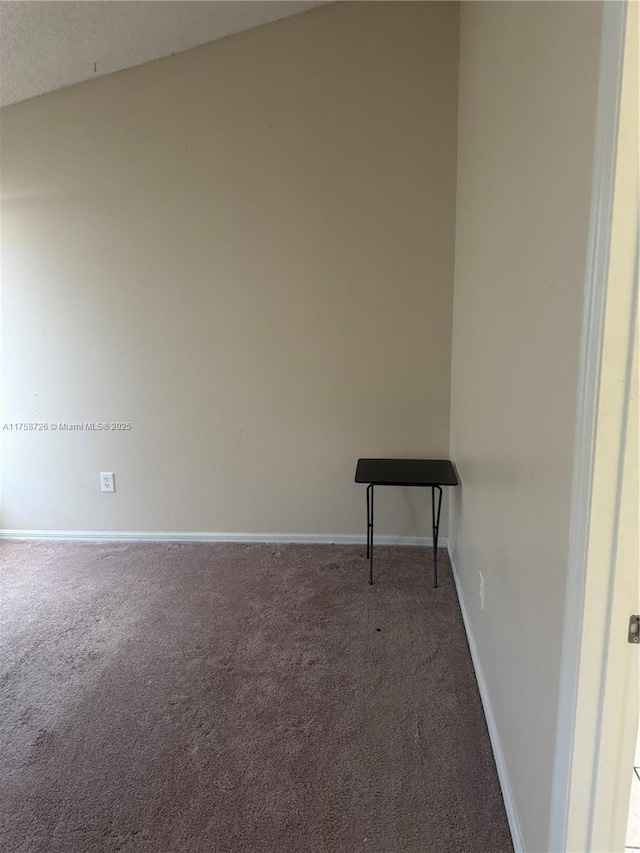 carpeted spare room with baseboards