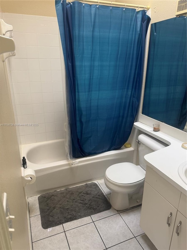 full bath featuring tile patterned floors, shower / bathtub combination with curtain, toilet, and vanity