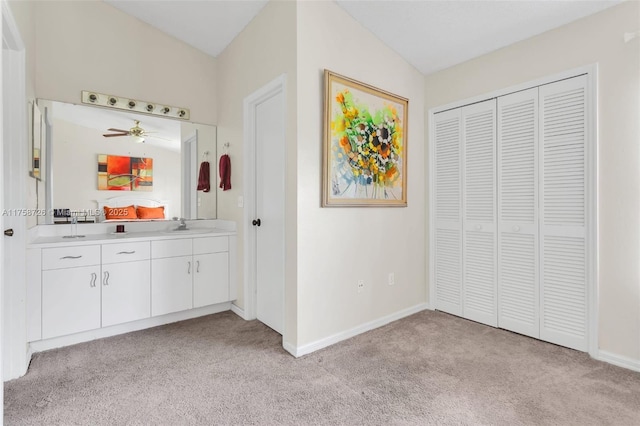 12140 Bruceton Way Unit 102, Orlando, FL 32828 - bathroom with carpet, a closet, vanity, and baseboards