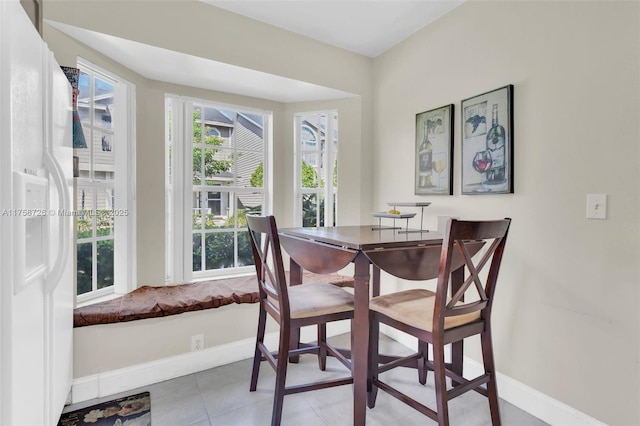 12140 Bruceton Way Unit 102, Orlando, FL 32828 - dining room with tile patterned floors and baseboards
